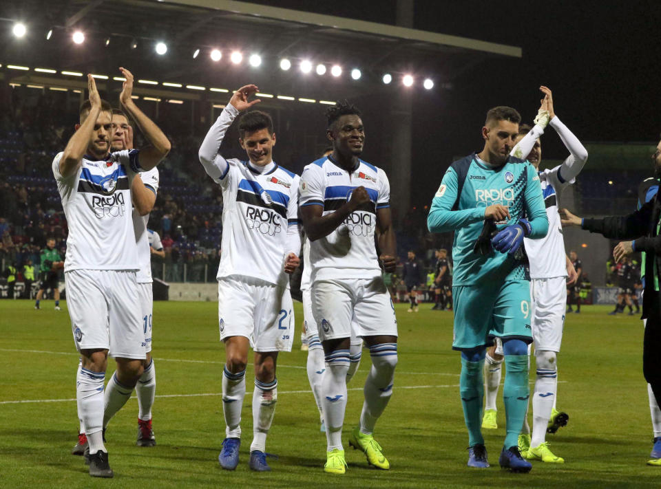 Atalanta's players celebrate at the end of the Italian Cup, quarterfinal soccer match between Cagliari and Atalanta, at the Sardegna Arena in Cagliari, Italy, Monday, Jan. 14, 2019. Atalanta left it late to win at Cagliari 2-0 to set up an Italian Cup quarterfinal against Juventus. (Fabio Murru/ANSA via AP)