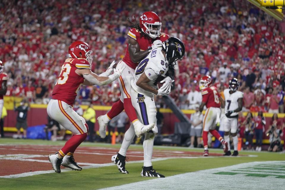 Baltimore Ravens tight end Isaiah Likely catches a pass with his toe barely out of bounds