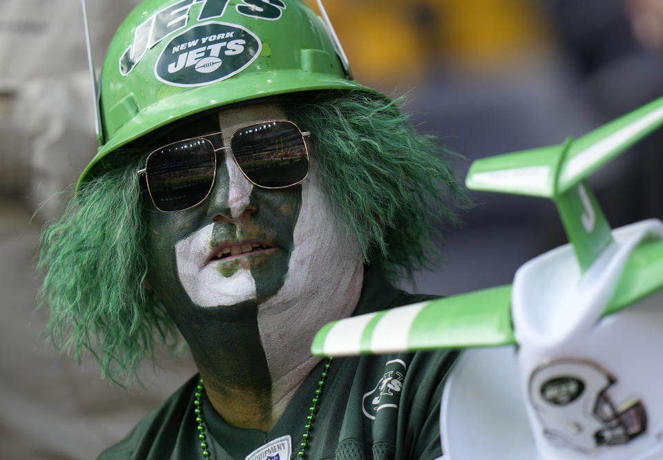 A New York Jets fan takes their seat before an NFL football game between the New York Jets and the Atlanta Falcons at the Tottenham Hotspur stadium in London, England, Sunday, Oct. 10, 2021. (AP Photo/Alastair Grant)