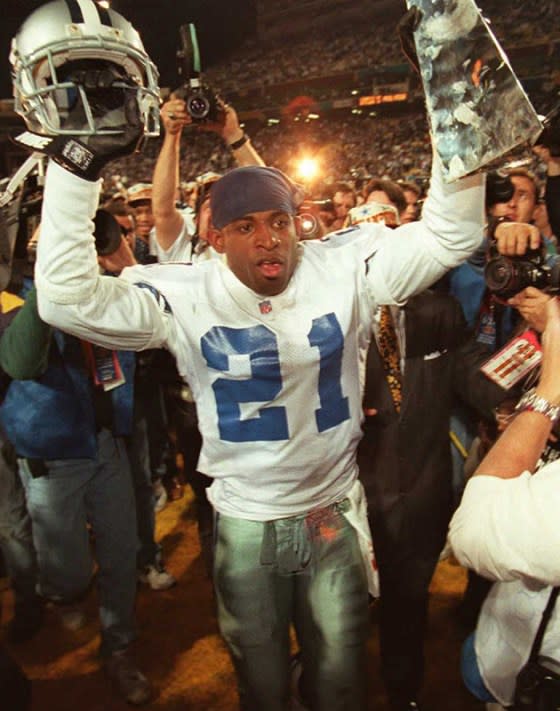Sanders celebrates a 1996 Super Bowl win with the Dallas Cowboys<span class="copyright"> Vince Bucci—AFP/Getty Images</span>