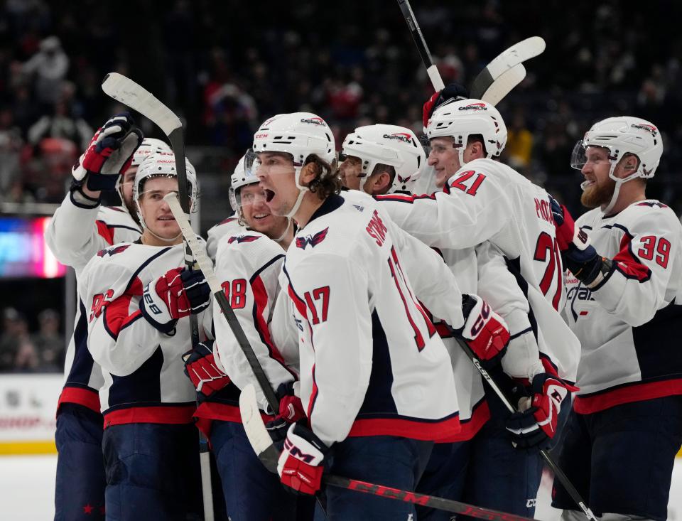 Dec. 201, 2023; Columbus, Ohio, USA; 
Washington Capitals center Dylan Strome (17) taunts Columbus Blue Jackets goaltender Elvis Merzlikins (90) following a 3-2 win in overtime at Nationwide Arena on Thursday.