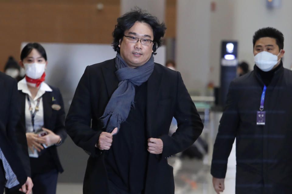 South Korean director Bong Joon-ho arrives at the Incheon International Airport in Incheon, South Korea, Sunday, Feb. 16, 2020. South Koreans are reveling in writer-director Bong's dark comic thriller, "Parasite," which won this year's Academy Awards for best film and best international feature. The movie itself, however, doesn't put the country in a particularly positive light. (AP Photo/Ahn Young-joon)