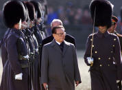 FILE - Chinese then President Jiang Zemin, center, inspects the honor guard in London during his four-day state visit to the United Kingdom, the first to Britain by a Chinese head of state, Oct. 19, 1999. Chinese state TV said Wednesday, Nov. 30, 2022, that Jiang has died at age 96. (Paul Hackett/Pool Photo via AP, File)