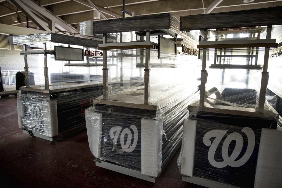 Food stalls are covered and empty in the concourse as the Washington Nationals hold their first training camp work out at Nationals Stadium, Friday, July 3, 2020, in Washington. (AP Photo/Andrew Harnik)