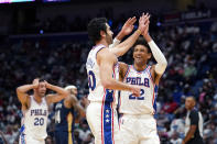 Philadelphia 76ers guard Furkan Korkmaz celebrates his 3-pointer with guard Matisse Thybulle (22) and forward Georges Niang (20) in the second half of an NBA basketball game in New Orleans, Wednesday, Oct. 20, 2021. The 76ers won 117-97. (AP Photo/Gerald Herbert)