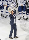 Tampa Bay Lightning head coach Jon Cooper hoists the Stanley Cup after defeating the Dallas Stars in the NHL Stanley Cup hockey finals, in Edmonton, Alberta, on Monday, Sept. 28, 2020. (Jason Franson/The Canadian Press via AP)