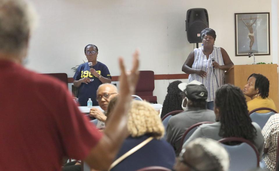 Daytona Beach Zone 6 City Commissioner Paula Reed is pictured in a white sleeveless top standing near Daytona Beach NAACP President Cynthia Slater as the two took questions in October last year at a meeting held to discuss flooding problems in the Midtown neighborhood.