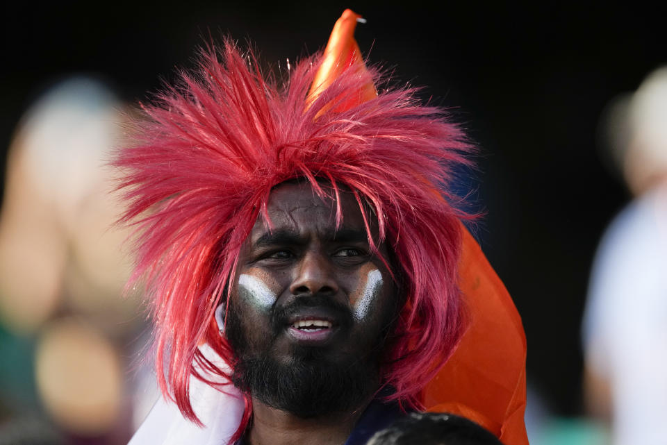 A Indian supporter waits for the start of the T20 World Cup cricket match between India and the Netherlands in Sydney, Australia, Thursday, Oct. 27, 2022. (AP Photo/Rick Rycroft)