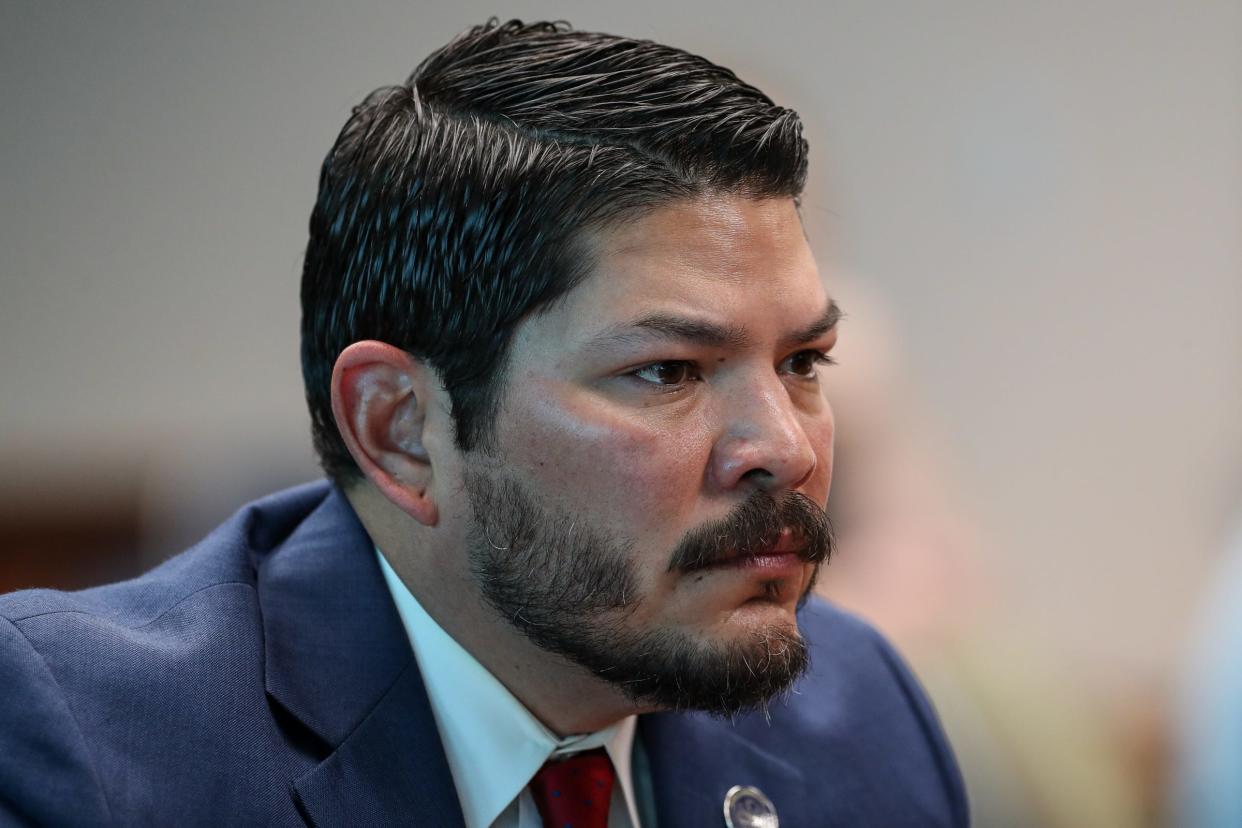 Nueces County District Attorney Mark Gonzalez waits for a hearing on a petition seeking his removal from elected office, to begin on Wednesday, March 8, 2023, at the county courthouse in Corpus Christi, Texas.