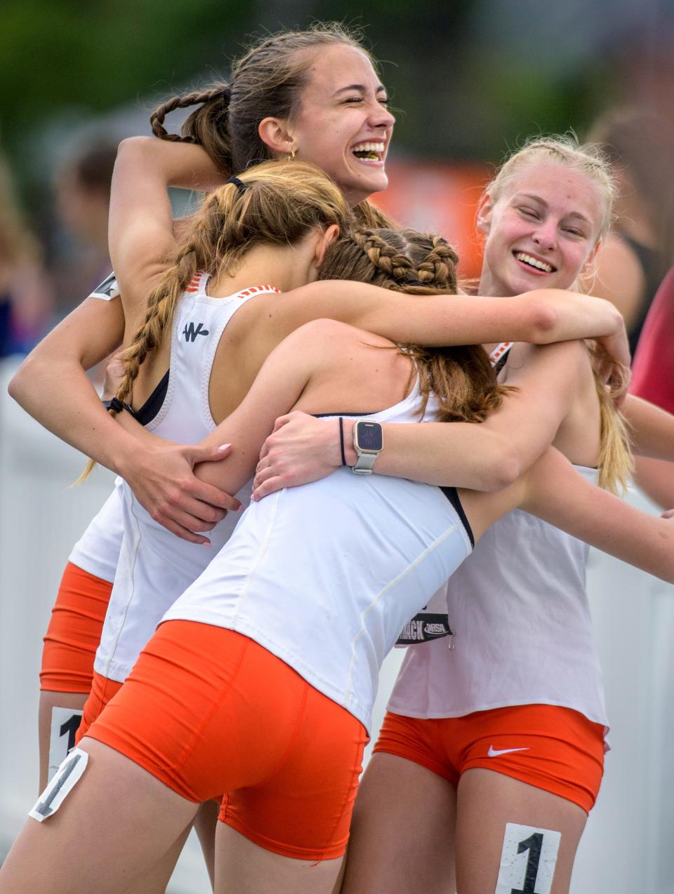 Runners on the Winnebago 4X800-meter relay team celebrate their state title in the event during the Class 1A State Track and Field Championships in Saturday, May 21, 2022 at Eastern Illinois University.