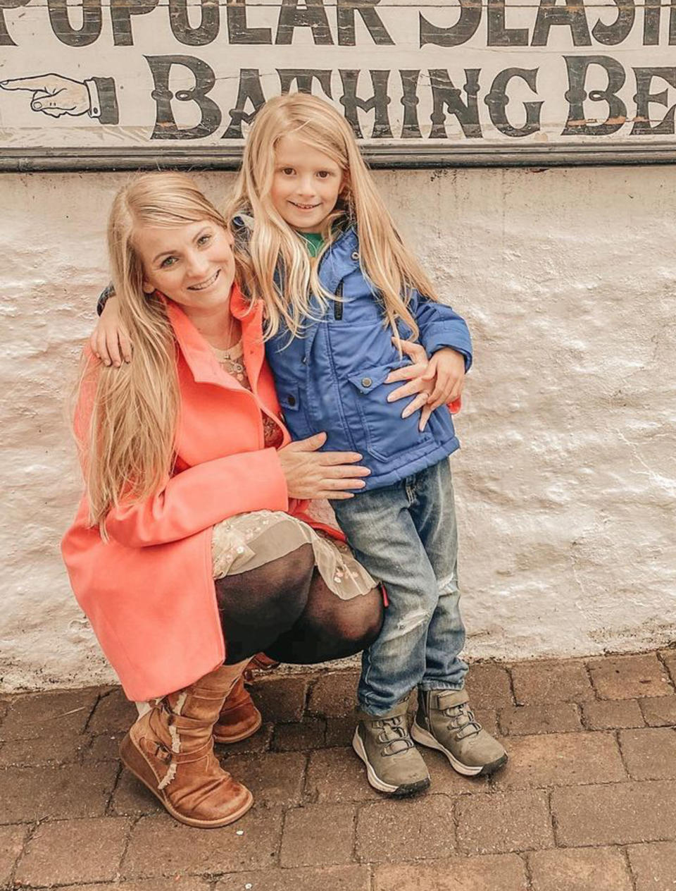 Cresswell with her eldest son Jaxon who has waist length hair. (Caters)