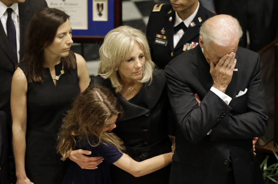 U.S. Vice President Joe Biden, right, rests his head in his hand during a viewing for his son, former Delaware Attorney General Beau Biden, Thursday, June 4, 2015, at Legislative Hall in Dover, Del. Standing with Vice President Biden are Beau Biden's widow, Hallie, from left, and daughter Natalie, and the the vice president's wife Jill. Beau Biden died of brain cancer Saturday at age 46. (AP Photo/Patrick Semansky, Pool)