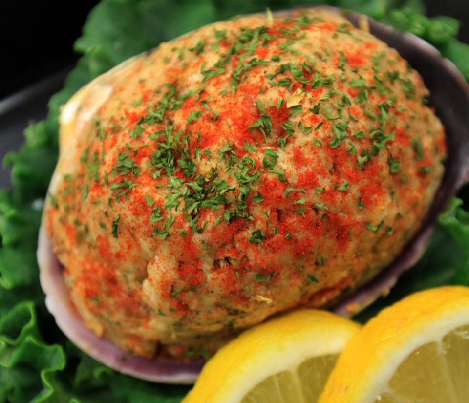 Stuffies, or stuffed quahog clams, are sold in markets, like this one from Dockside Seafood Marketplace in Warwick, as well as restaurant dishes at clam shacks and in fine dining establishments.