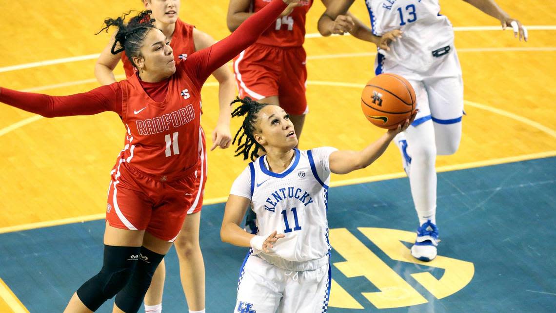 Kentucky’s Jada Walker (11) drives against Radford’s Ashlyn Traylor (11) on Monday night in Memorial Coliseum. Walker led the Wildcats in their season opener with 19 points.