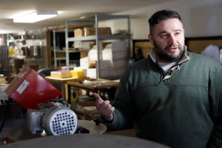 Igor Yakolev demonstrates the process of making CBD honey at Beezy Beez in the Staten Island borough of New York, U.S., March 20, 2019. Picture taken March 20, 2019. REUTERS/Shannon Stapleton