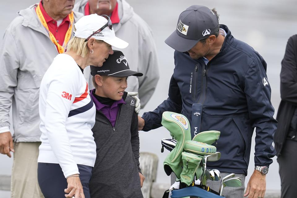 Annika Sorenstam, of Sweden, and Mike McGee congratulate their son, Will McGee, after he hit shot to the seventh green during a practice round for the U.S. Women's Open golf tournament at the Pebble Beach Golf Links, Wednesday, July 5, 2023, in Pebble Beach, Calif. (AP Photo/Darron Cummings)