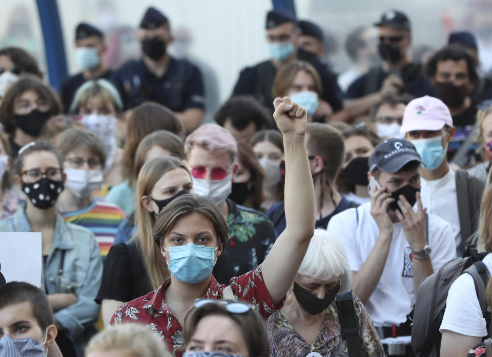 Protesters taking part in a rally against Polish government plans to withdraw from the Istanbul Convention on prevention and combatting of home violence, in Warsaw, Poland, on Friday, July 24, 2020. In the opinion of Poland's right-wing government the convention promotes "gender" ideologies alien to Poland's Catholic tradition.(AP Photo/Czarek Sokolowski)