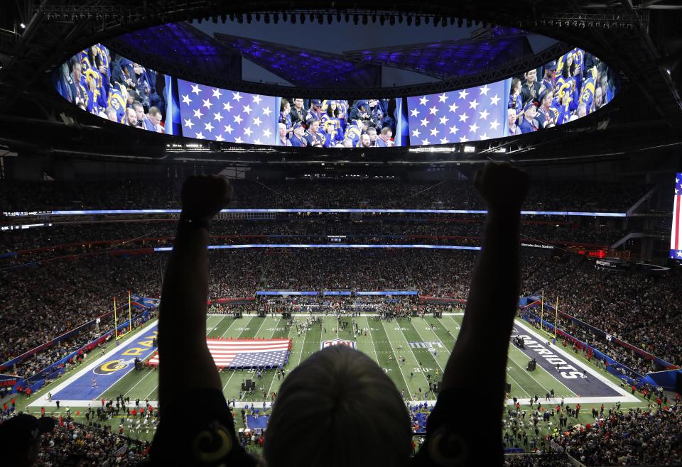 <p>A fan watches the national anthem before the first half of the NFL Super Bowl 53 football game between the Los Angeles Rams and New England Patriots, Sunday, Feb. 3, 2019, in Atlanta. (AP Photo/David Goldman) </p>