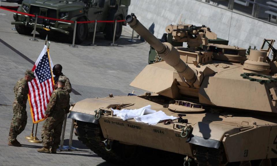 US soldiers in discussion near an M1/A2 Abrams tank in Kielce, Poland, last September.