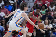 Oklahoma City Thunder guard Josh Giddey (3) knocks away a pass by New Orleans Pelicans forward Herbert Jones (5) in the second half of Game 3 of an NBA basketball first-round playoff series in New Orleans, Saturday, April 27, 2024. The Thunder won 106-85. (AP Photo/Gerald Herbert)