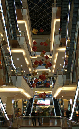 People stand inside the Shahba Mall in Aleppo, Syria December 12, 2009. Picture taken December 12, 2009. REUTERS/Khalil Ashawi