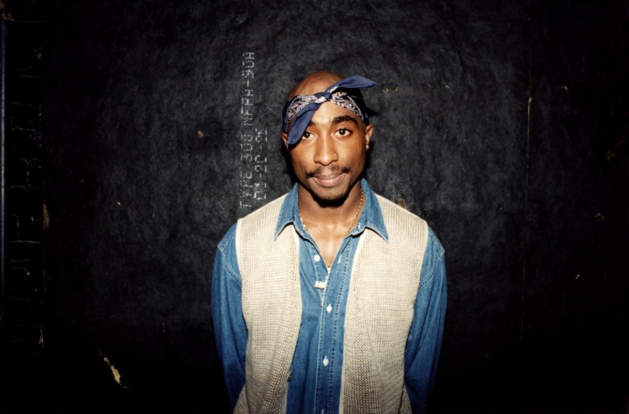 Rapper Tupac Shakur poses for photos backstage after his performance at the Regal Theater in Chicago, Illinois in March 1994.