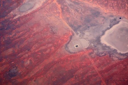 Roads and a small dam can be seen next to dried-up lakes located in outback Australia in this aerial picture taken on December 13, 2015. REUTERS/David Gray