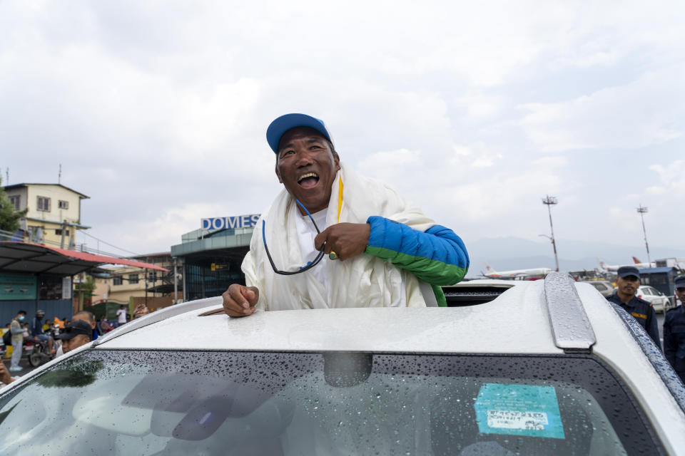 Renowned Sherpa mountain guide Kami Rita returning from Mount Everest after his record 30th successful ascent, arrives at the airport in Kathmandu, Nepal, Friday, May 24, 2024. (AP Photo/Niranjan Shrestha)