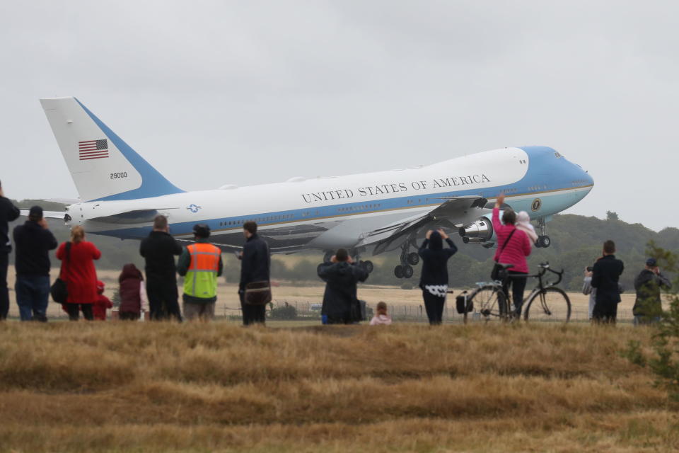 <p>People watch as Air Force One takes off from Prestwick Airport in Ayrshire, as President Donald Trump and his wife Melania leave the U.K. , after spending the weekend at the Trump Turnberry resort, bound for Finland where the president will hold talks with Russian leader Vladimir Putin in Helsinki, following meetings with Theresa May and the Queen in a whirlwind tour that took place amid mass protests against his policies across the U.K. (Photo: Andrew Milligan/PA Images via Getty Images) </p>