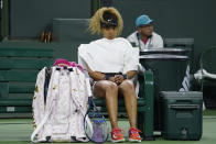 Naomi Osaka, of Japan, sits down between sets during her match against Veronika Kudermetova, of Russia, at the BNP Paribas Open tennis tournament Saturday, March 12, 2022, in Indian Wells, Calif. (AP Photo/Mark J. Terrill)