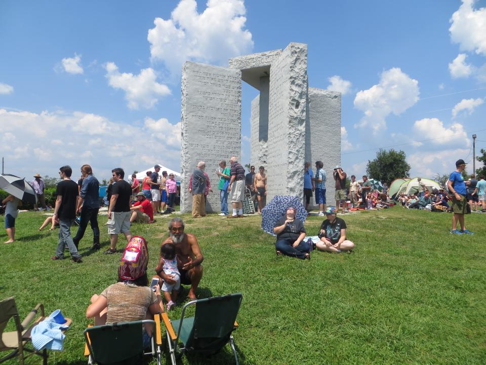 FILE - People gathered at the Guidestones a few years ago for the full eclipse of the sun.