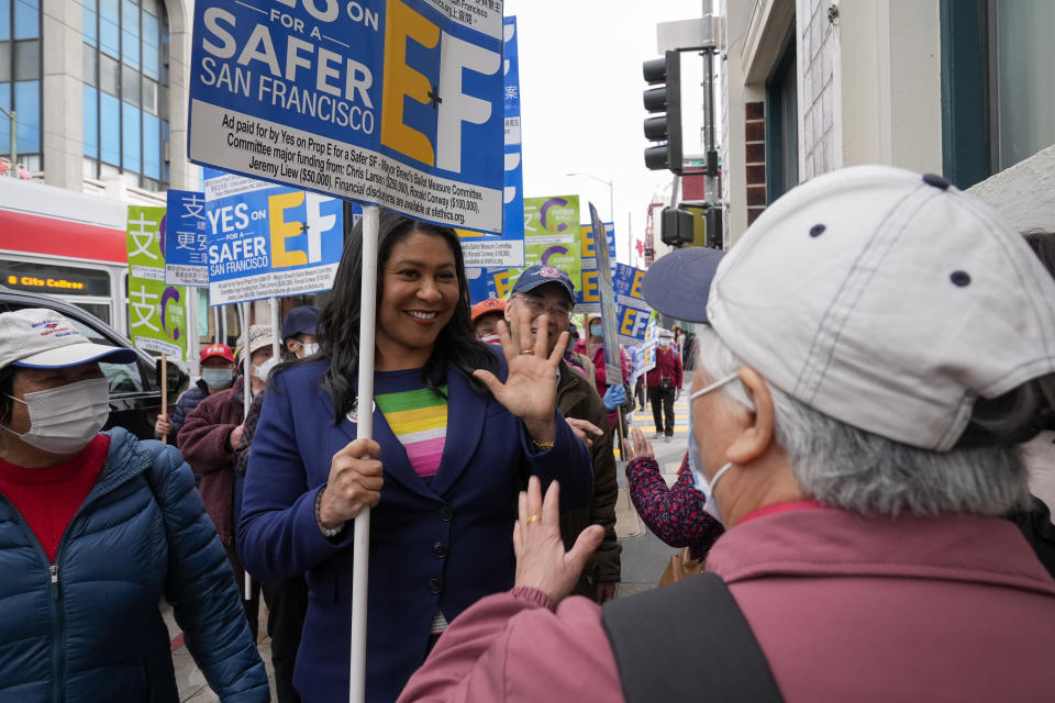 San Francisco Mayor London Breed, center, greets people in the city's Chinatown district, encouraging them to vote in the state's primary election Tuesday, March 5, 2024, in San Francisco. Breed also encouraged people to support Props C, E, and F. (AP Photo/Godofredo A. Vásquez)