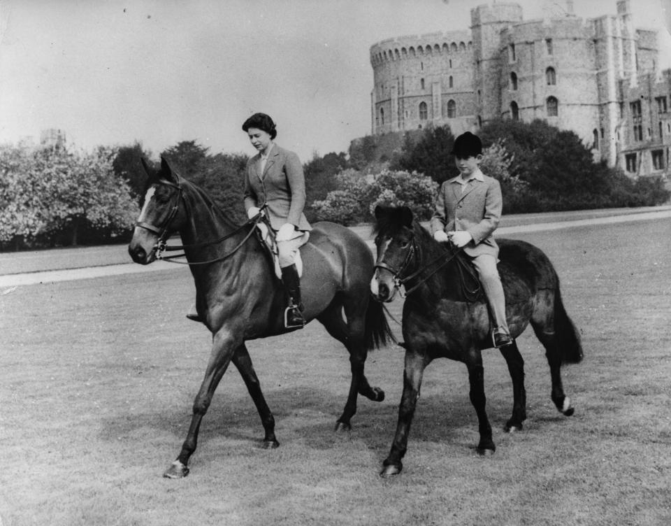 EMBARGOED TO 2230 SUNDAY MAY 31 File photo dated 18/5/1961 of Queen Elizabeth II and her son, Prince Charles, out riding at Windsor Castle. The Queen has been seen riding her horse this weekend in Windsor Home Park as she has been in residence at Windsor Castle during the coronavirus pandemic.