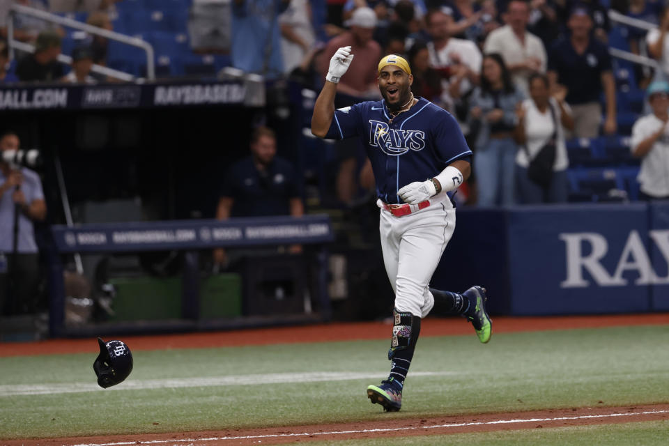 Tampa Bay Rays' Yandy Diaz celebrates while circling the bases after hitting a two-run home run against the Seattle Mariners during a baseball game Saturday, Sept. 9, 2023, in St. Petersburg, Fla. (AP Photo/Scott Audette)