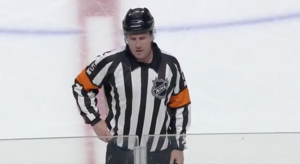 NHL referee Dan Kelly prepares to announce a penalty during a preseason game between the Florida Panthers and Montreal Canadiens on Thursday night. (Twitter//@ScoutingTheRefs)