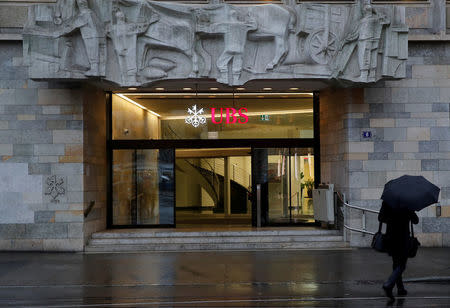 FILE PHOTO: The logo of Swiss bank UBS is seen at a branch office in Zurich, Switzerland January 22, 2018. REUTERS/Arnd Wiegmann/File Photo