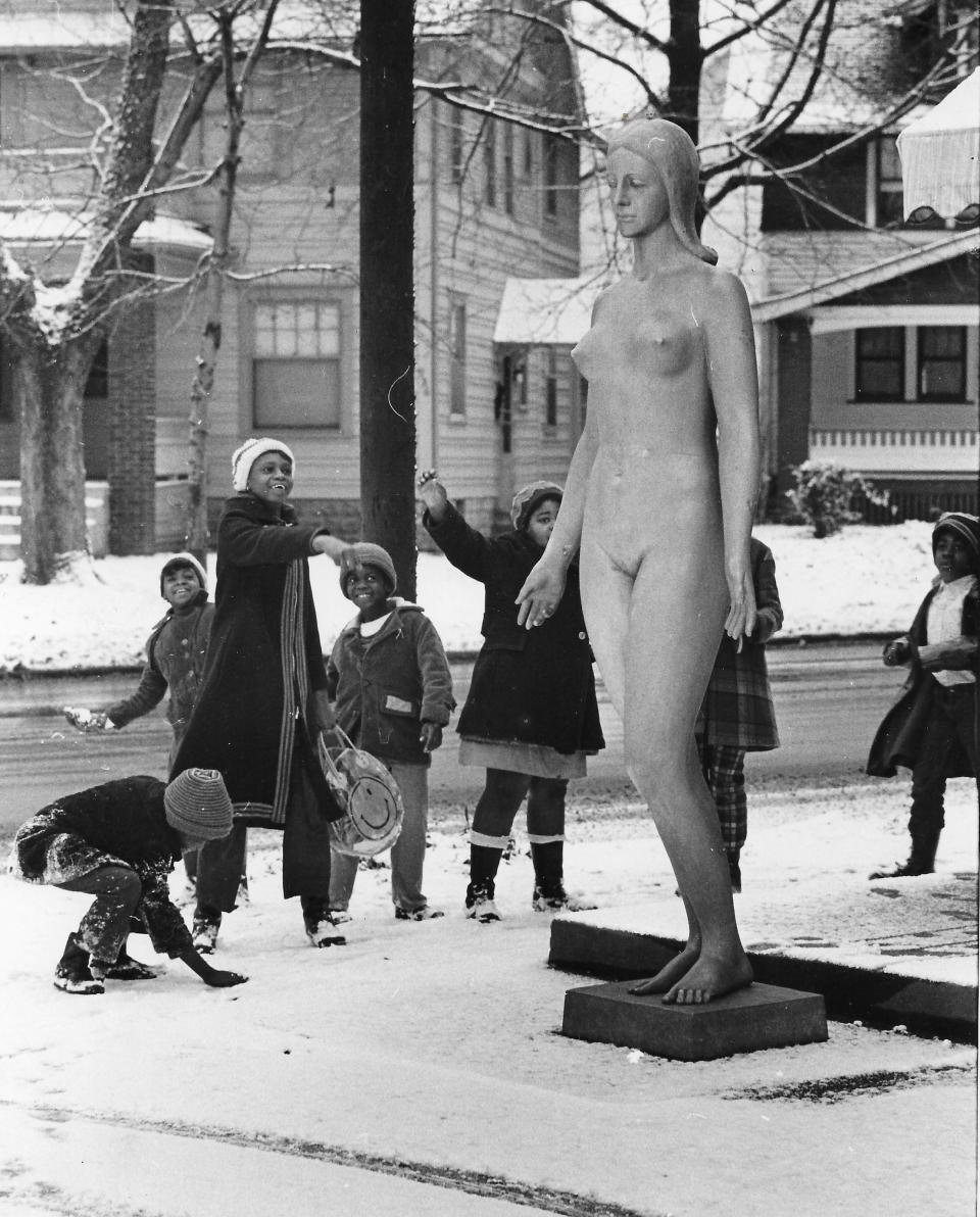 Akron schoolchildren throw snowballs at a statue of Minerva on Dec. 1, 1972, outside the Packard Gallery at West Exchange Street and Grand Avenue in Highland Square.