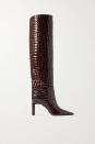 <p><strong>THE ATTICO</strong></p><p>net-a-porter.com</p><p><strong>$1070.00</strong></p><p>Embossed shine, a croc-effect, and a pointed toe all give this high boot a boost of va-va-voom. </p>