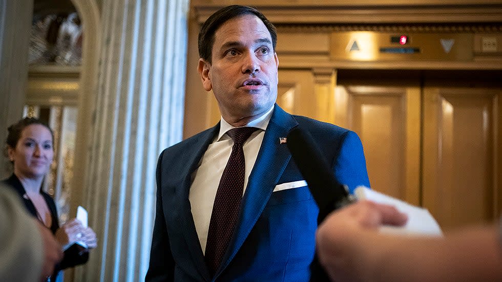 Sen. Marco Rubio (R-Fla.) speaks to a reporter before heading to the Senate Chamber for a vote regarding a nomination on Thursday, December 2, 2021.