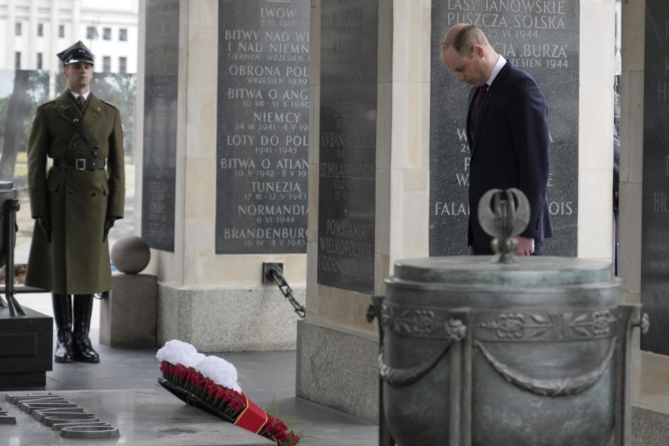 Britain's Prince William lays a wreath of flowers at the Tomb of the Unknown Soldier in Warsaw, Poland, Thursday, March 23, 2023. (AP Photo/Czarek Sokolowski)
