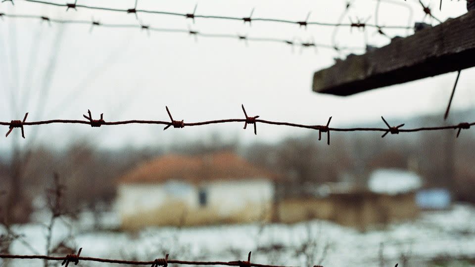 A view of Cotul Morii village through a barbed wire fence. - ABACA/Shutterstock