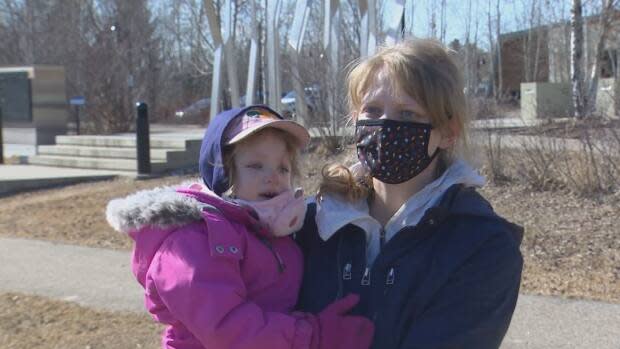 Teacher and parent Chelsey Wood, with her two-year-old daughter Katherine, says she began to grow concerned about the curriculum development process when the government cut teachers out of the writing process.