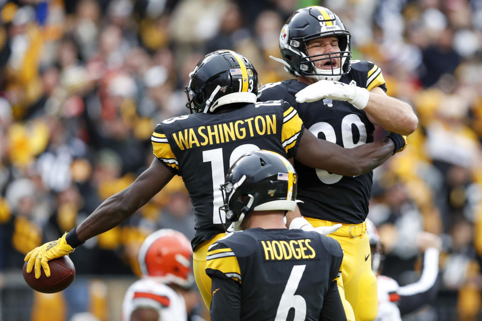 Pittsburgh Steelers wide receiver James Washington (13) celebrates with tight end Vance McDonald (89) after making a touchdown catch from Steelers quarterback Devlin Hodges (6) during the first half of an NFL football game against the Cleveland Browns, Sunday, Dec. 1, 2019, in Pittsburgh. (AP Photo/Don Wright)