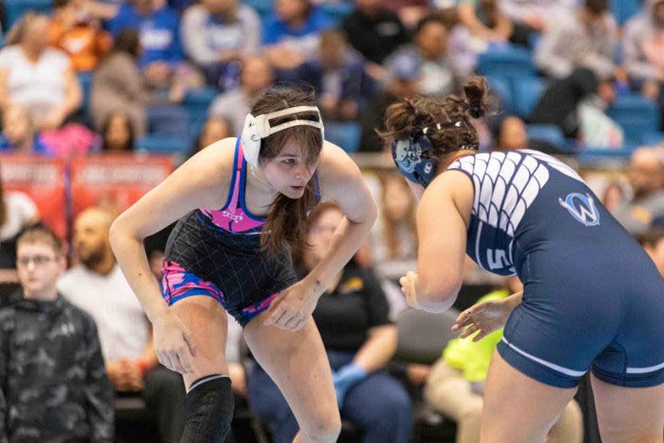 Washburn Rural's Laiken Clark faces off against Olathe West's Maci Pearson during 6-5A Girls State Wrestling at Hartman Arena on Saturday, Feb. 24, 2024.