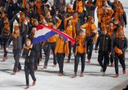 Flag-bearer Jorien ter Mors of the Netherlands leads her country's contingent during the opening ceremony of the 2014 Sochi Winter Olympics, February 7, 2014. REUTERS/Mark Blinch (RUSSIA - Tags: OLYMPICS SPORT)