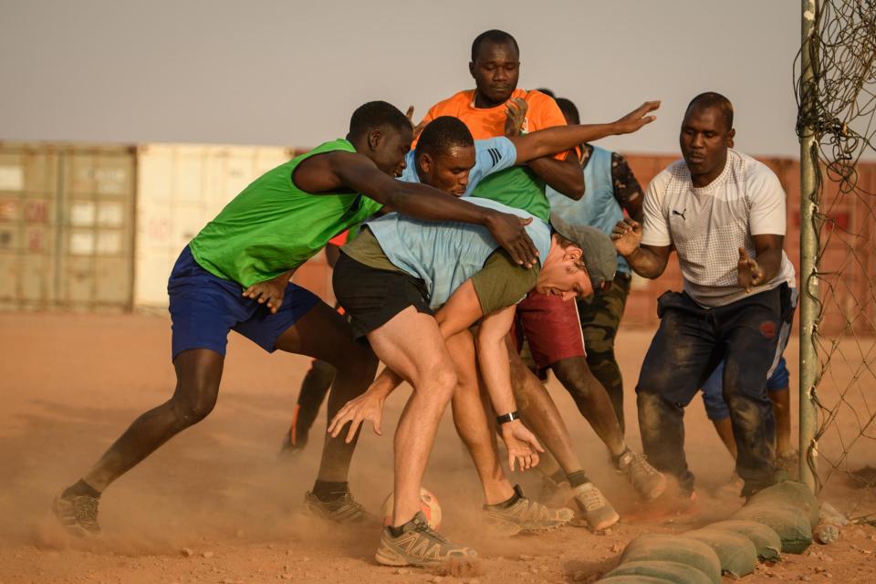 Jackson, a Special Forces soldier, plays handball with Nigerien EFoN soldiers at their camp near Ouallam, March 9, 2022.