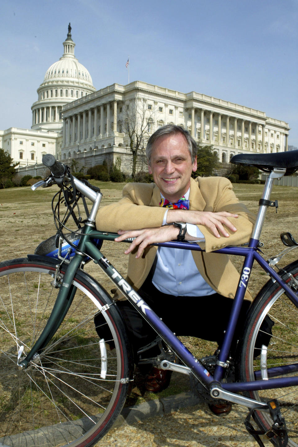 FILE - Rep. Earl Blumenauer, D-Ore., founder and chairman of the bipartisan Congressional Bike Congress poses with his bike on Capitol Hill Thursday, March 13, 2003. Blumenauer, a quirky but deeply respected figure in Oregon politics for decades, has decided not to seek reelection after 27 years in Congress, citing turmoil on Capitol Hill and a desire to be more involved in addressing the challenges facing his hometown of Portland. (AP Photo/Matthew Cavanaugh, File)