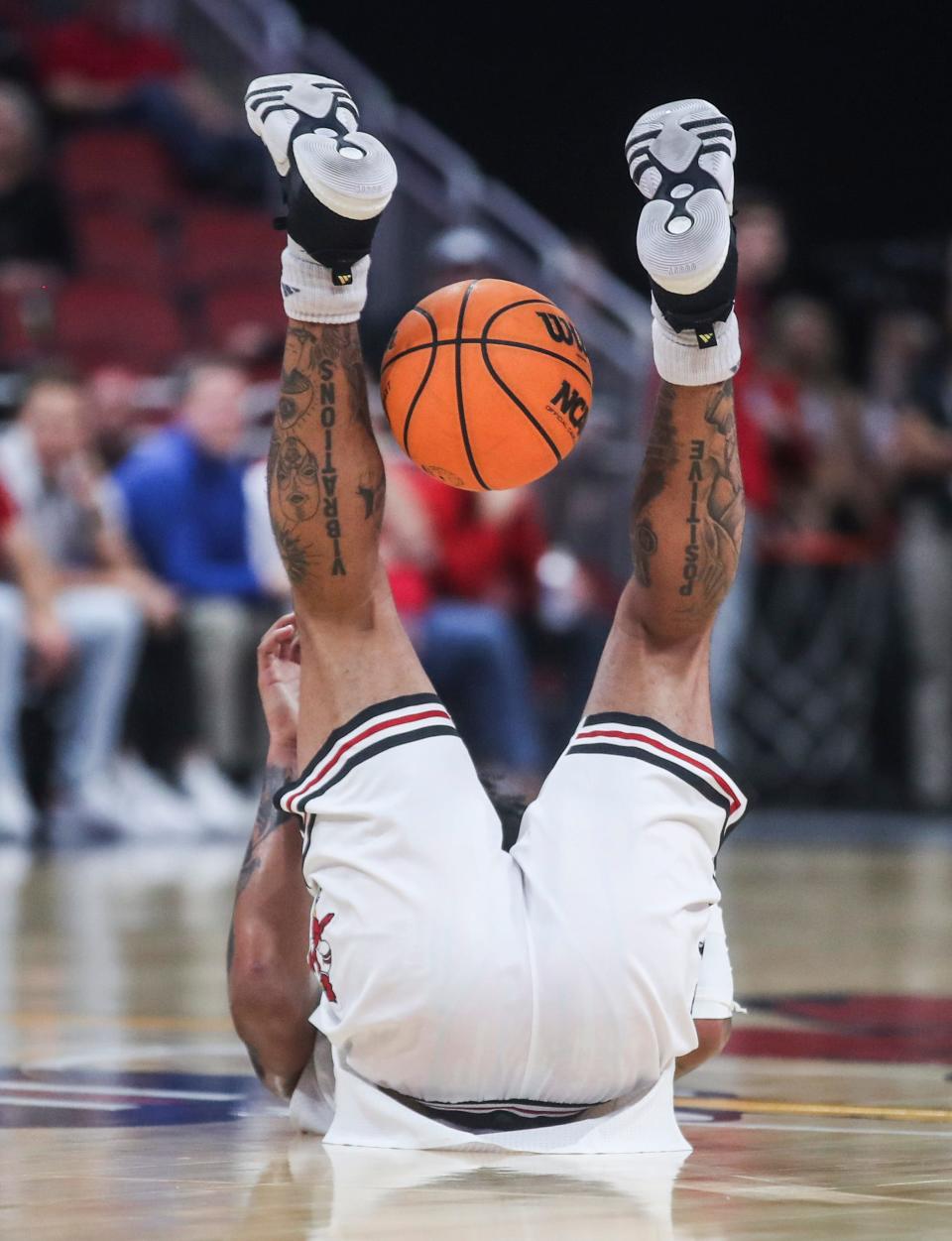 Louisville guard Skyy Clark gets upended during the second half. Clark had 10 points and five rebounds Wednesday night.