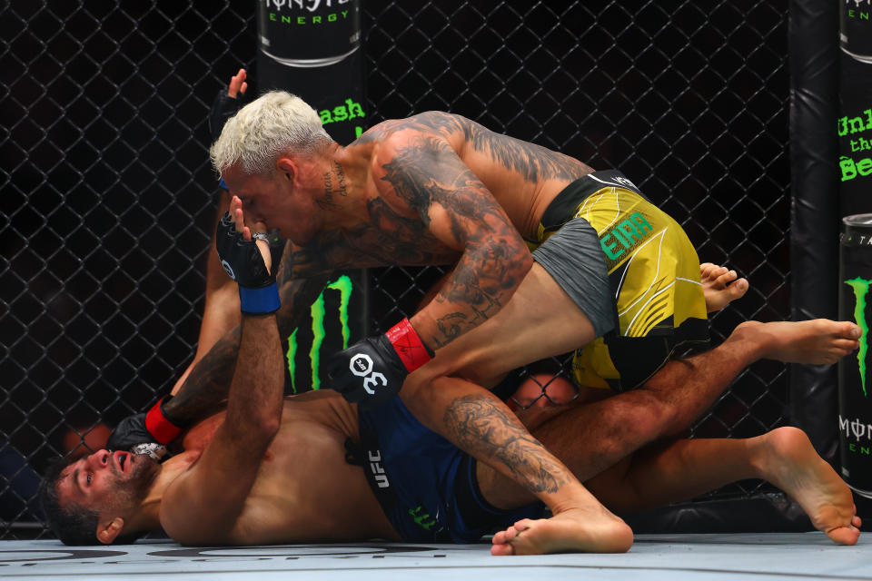 Jun 10, 2023; Vancouver, BC, Canada; Charles Oliveira lands a hit against Beneil Dariush during UFC 289 at Rogers Arena. Mandatory Credit: Sergei Belski-USA TODAY Sports