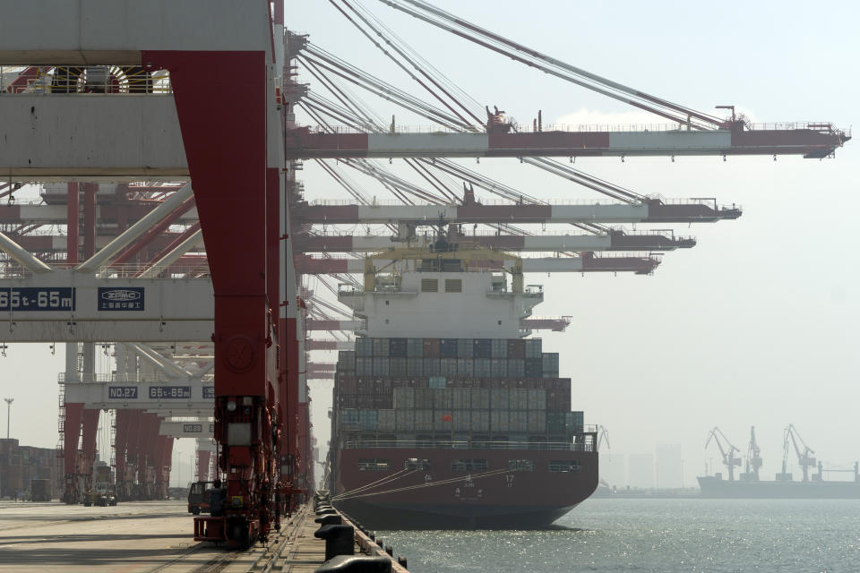 In this July 24, 2019, photo, a cargo ship is docked a port in Yingkou in northeastern China's Liaoning Province. Authorities in China's rust-belt region are looking for support for its revival from Beijing's multibillion-dollar initiative to build ports, railways and other projects abroad. (AP Photo/Olivia Zhang)